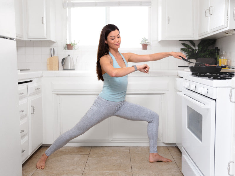 Woman exercising in the kitchen