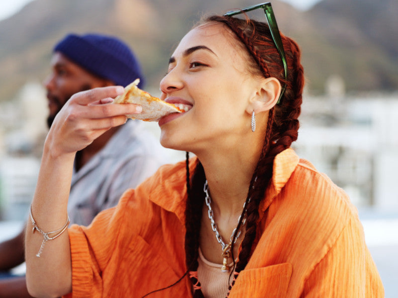 Woman eating pizza