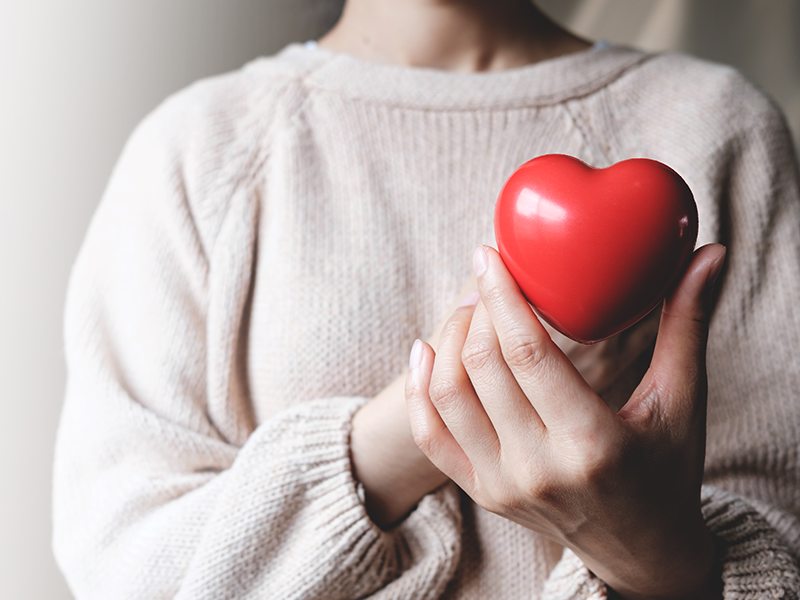 Women holding a heart
